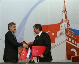 Kazan, russia, march 4, 2011, turkish energy minister taner yildiz (l) and russian vice-prime minister igor sechin shake hands during the signing ceremony at the 11th meeting of the russian-turkish in...