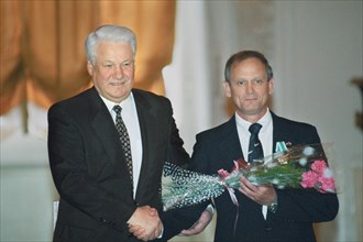 Russia, moscow, president of russia boris yeltsin presents nasa astronaut norman thagard with the order of friendship, april 12, 1996.