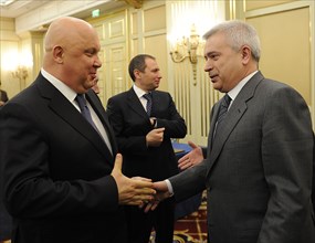 Moscow, russia, april 15, 2011, alexander goncharuk, chairman of the board at bashneft, left, and lukoil chairman vagit alekperov (r) chat after the signing of a letter of intent between bashneft and ...