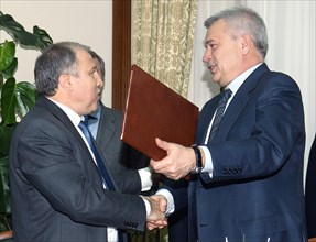 Moscow, russia, april 22, 2011, rosneft chairman eduard khudainatov and president of lukoil vagit alekperov (l-r) have signed a deal for joint exploration and production offshore.