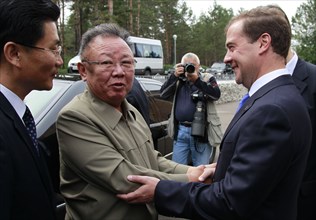 Ulan-ude, russia, august 24, 2011, russia's president dmitry medvedev (r) welcomes kim jong-il (kim jong il), the leader of the democratic people's republic of korea (north korea), the chairman of the...