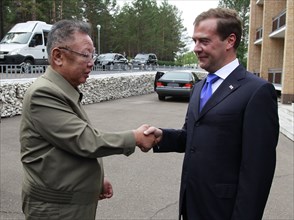 Ulan-ude, russia, august 24, 2011, russia's president dmitry medvedev (r) welcomes kim jong-il (kim jong il), the leader of the democratic people's republic of korea (north korea), the chairman of the...