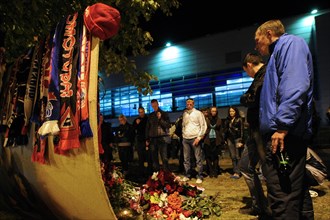 Yaroslavl, russia, september 8, 2011, lokomotiv yaroslavl fans commemorate players of a khl ice hockey team lokomotiv who died in a yak-42 passenger plane crash on september 7 by laying flowers and li...