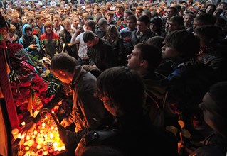 Moscow, russia, september 8, 2011, fans of hc lokomotiv lay flowers and light candles outside the office of the yaroslavl government in moscow to commemorate lokomotiv yaroslavl players who died in a ...