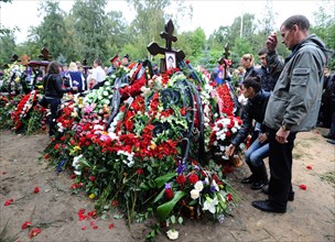 Yaroslavl, russia, september 10, 2011, relatives and fans grieve during the funeral of 14 hc lokomotiv yaroslavl players at leontyevskoye cemetery, a yakovlev yak 42 charter flight, which was to take ...