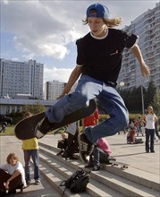 Teenagers skateboard in moscow's krylatskoye district, august 22, 2005.