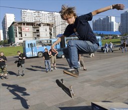 Young people skateboard in moscow's krylatskoye district, august 22, 2005.