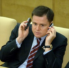 Moscow, russia, september 14, deputy chairman of the committee on civil, criminal, arbitral and procedural law vladimir gruzdev talks over cell phones during a plenary session of the russian state dum...
