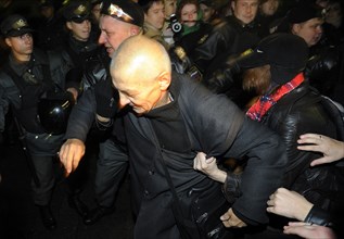 Moscow, russia, october 12, 2011, left front movement’s coordinator konstantin kosyakin being detained as demonstrators tried to break a police cordon during an authorised day of wrath protest in triu...