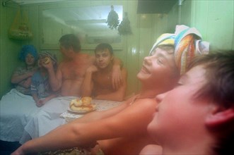 A father and his sons wash up in a russian sauna (banya) built by themselves, the karelovs organized a family-style orphanage for 11 children in a village of zavolzhsky district, 2005.