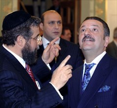Moscow, russia moscow chief rabbi pinchas goldschmidt (l) and president of the ast group of companies telman ismailov are pictured during the reception that is held in the run-up to the 100th annivers...