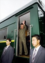 Vladivostok, russia, august 18, 2001, north koream leader kim jong il pictured greeting people from the doors of the armourd train upon his arrival on saturday at the station khasan