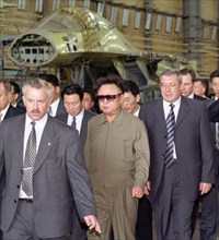 Novosibirsk, russia, august 11, 2001, the north korean leader kim jong il (c) who arrived in novosibirsk on saturday pictured visiting the the assembly shop of the su-34 most modern fighter-bombers at...
