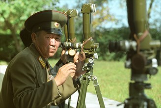 North korean border guard on the frontier with south korea at an observation post, 2002.