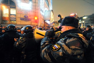 Moscow, russia, december 5, 2011, a police officer with a megaphone at an opposition protest in central moscow against alleged vote-rigging in the december 4 parliamentary election.