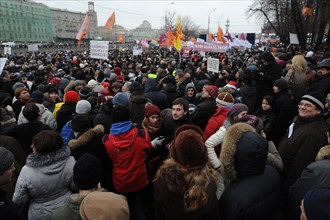 Moscow, russia, december 10, 2011, people attend an authorized rally 'for honest elections' in moscow's bolotnaya square to protest against electoral fraud at recent elections to the state duma.