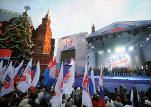 Moscow, russia, december 12, 2011, demonstrators listen to pro-kremlin activists during a rally in support of medvedev and putin in central moscow, the event took place two days after a mass protest a...