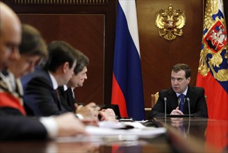 Moscow region, russia, december 13, 2011, president of russia dmitry medvedev (background) holds a meeting with officials from the government, presidential administration and the expert community to d...