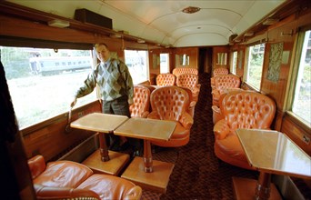 Vologda, russia, september 14, 2002, alexander kononov examines the interior of one of the buffet cars of 'the orient express'