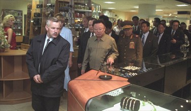 Visiting north korean leader kim jong-il (c) touring the trade complex 'ignat' in vladivostok 8/23/02.