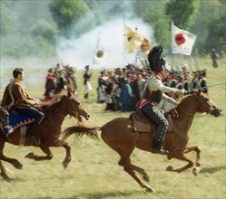 Moscow region, russia, september 3, 2001, a cavalry attack is performed by the participants in the military historical reconstruction of the borodino battle of the war with napoleon of year 1812, pict...