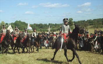 Moscow region, russia, september 3, 2001, participants in the military historical reconstruction of the borodino battle of the war with napoleon of year 1812, dressed as russian hussars, pictured on m...