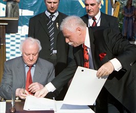 Georgia, august 21, 2003, georgian president eduard shevardnadze (l) and well-known businessman badri patarkatsishvili (r) signed documents on the beginning of construction a health resort 'imedis kal...