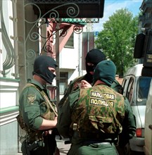 Moscow, russia, may 11, 2000, the officers of the tax police in masks pictured at the office of the media- most holding, headed by vladimir gusinsky, where searches were made in connection with crimin...