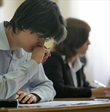 Moscow high school students take the single state exam in social studies, moscow, russia, may 23, 2006.