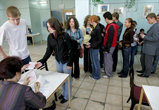 Checking high school students present ids before the single state exam in social studies at a moscow school, moscow, russia, may 23, 2006.