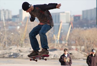 A teenager skateboarding in vladivostok, russia, august 2005.