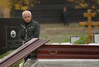 Alexander politkovsky, former husband of assassinated journalist, special correspondent for the novaya gazeta newspaper, anna politkovskaya attends her funeral at troyekurovskoye cemetery, moscow, rus...