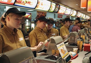Moscow, russia, november 20, 2006, cashiers at the mcdonald's fast food restaurant in pushkin square, moscow.