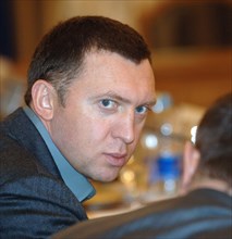 Moscow, russia, november 23, 2006, rusal chairman oleg deripaska attends a meeting between russia's first deputy premier (unseen) and members of the fund for support of russian olympians.