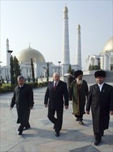 Ashgabat, turkmenistan, february 15, 2007, russian prime minister mikhail fradkov, centre, walks on a visit to the tomb of president of turkmenistan saparmurat niyazov at the mosque called spirit of t...
