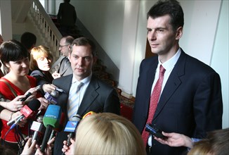 Krasnoyarsk, russia, new norilsk nickel ceo denis morozov and former norilsk nickel ceo mikhail prokhorov, l-r, answer questions from reporters after a meeting with the governor of krasnoyarsk territo...