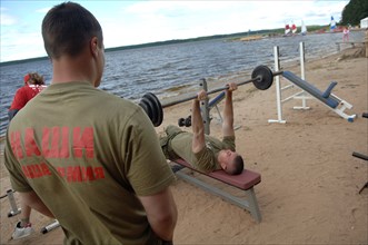Men exercising at the summer camp of the pro-putin nashi (our people) youth movement at the lake seliger resort, tver region, russia, july 21, 2007.