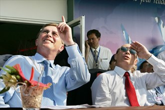 Russian first deputy prime minister sergei ivanov, russian president vladimir putin (l-r) watch the airshow at the opening ceremony of the 8th international aviation & space salon maks 2007  in the to...