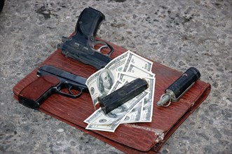 Pistols, a grenade and dollar bills of chechen militant leader musa mutiyev, the so-called 'emir of grozny', musa mutiyev was killed during a special operation in the leninsky district of grozny, chec...