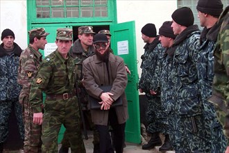 Makhachkala, russia, november 19, 2001, the defendant (c) being taken to his ward during a court hearing interval, the supreme court of the southern republic of dagestan has ended the third day of tri...