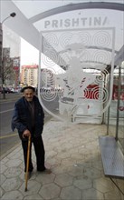 Elderly kosovan at a bus stop in pristina, kosovo, february 25, 2008.