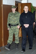 Moscow, russia, april 23, 2008, former yukos security chief alexei pichugin (r) is being escorted at the moscow city court where he denied that he had ever received orders to commit murder from billio...