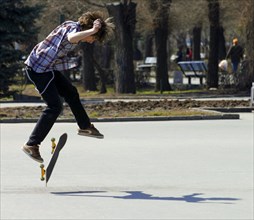 Skateboarder in a park in moscow, russia, may 2008.