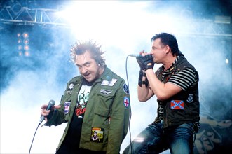 Mikhail gorshenev (l) and andrei knyazev of the punk rock band korol i shut perform in gorky park, moscow, august 1, 2008.