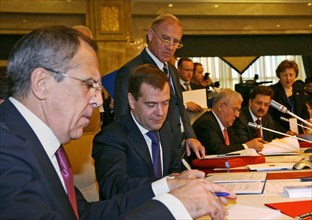 Foreign minister sergei lavrov (foreground) and president of russia dmitry medvedev (background) appear prior to the meeting of the council of the heads of state of the commonwealth of independent sta...