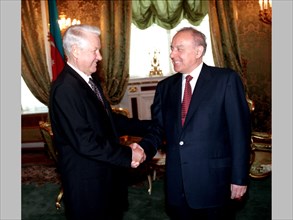 Presidents boris yeltsin of russia /left/ and geidar aliyev of azerbaijan paying an official visit to russia, are pictured shaking hands prior to a one-to-one meeting in the kremlin on jul, 3rd, later...