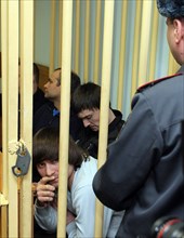 Suspects of murder of journalist anna politkovskaya, dzhabrail makhmudov (foreground), sergei khadzhikurbanov and ibragim makhmudov (l-r, background) appear at the hearing of moscow district military ...