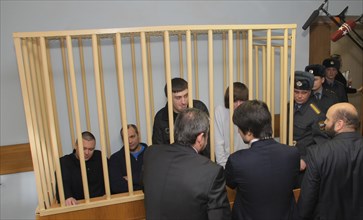 Suspects of murder of journalist anna politkovskaya, pavel ryaguzov, sergei khadzhikurbanov, ibragim makhmudov and dzhabrail makhmudov (l-r) appear at the hearing of moscow district military court, mo...