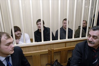 Dzhabrail makhmudov, ibragim makhmudov, pavel ryaguzov and sergei khadzhikurbanov (l-r, background), accused of murdering anna politkovskaya, novaya gazeta columnist, appear at the hearing of moscow d...