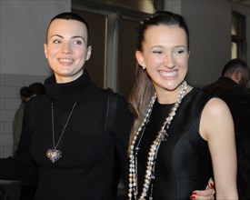 Moscow, russia, december 12, 2008, artist yuliya milner (l) and baibakov art center director maria baibakova appear at the opening of the invasion: evasion exhibition.
